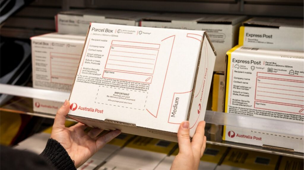 photo person holding parcel post box.jpg.auspostimage.1170 0.169.medium